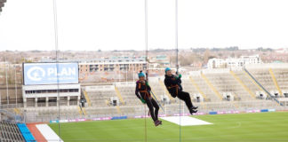 Angela Collins O'Mahony abseiling from the roof of Croke PArk with her daughter Martina.