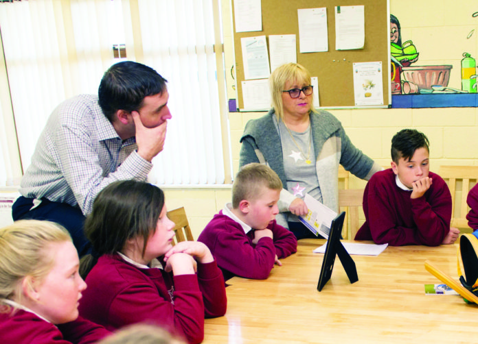 Ann Boland presenting a defibrillator to Corpus Christi school in Moyross. Photo: Cian Reinhardt