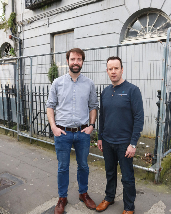 Cllr Joe Leddin (right) with his cousin and Green Party local election candidate Brian Leddin at the former Leddin family home in Catherine Street. Photo: Brendan Gleeson limerick post newspaper