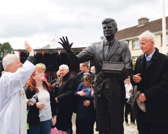 The Unveiling of the JFK Monument, the Ancestral home of the Kennedy Family 9 Fr Johnny Daly blessing the JFK statue in Bruff under the watchful eye of Michael Fitzgerald. Photo: Brendan Gleeson