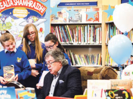 Gabriel Fitzmaurice with Sophie Ni Aodha, Abi Ni Shioda and Ella Ni Challanain at the launch of the Summer Stars scheme in Newcastle West library Photo: Keith Wiseman