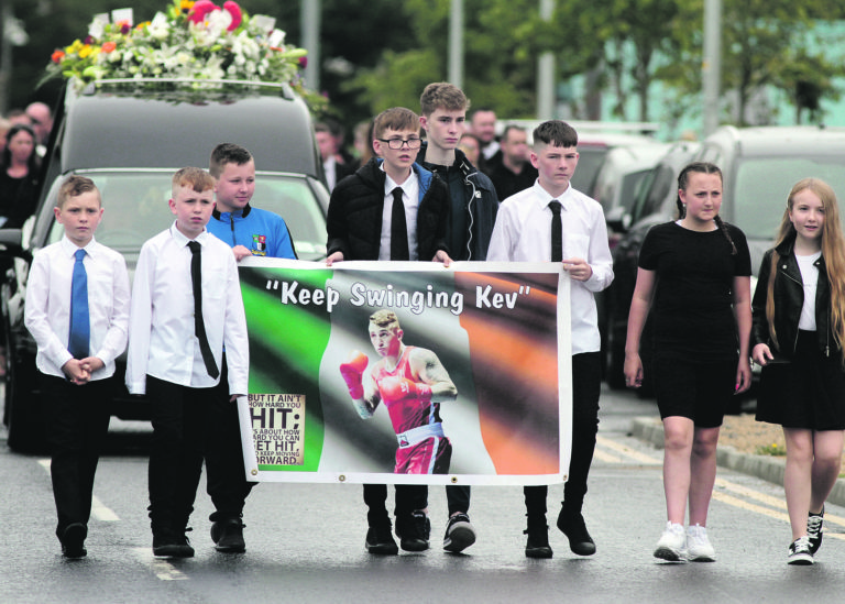 Heartbreak as boxing hero laid to rest