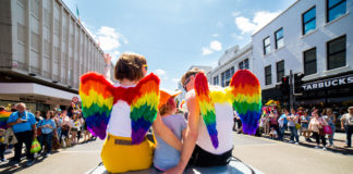 Grand Marshal Moninne Griffith, her wife Clodagh and their daughter Edie leading off the Limerick Pride Parade. Photo: Cian Reinhardt