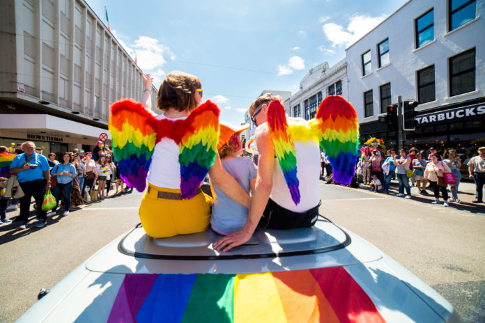 Grand Marshal Moninne Griffith, her wife Clodagh and their daughter Edie leading off the Limerick Pride Parade. Photo: Cian Reinhardt