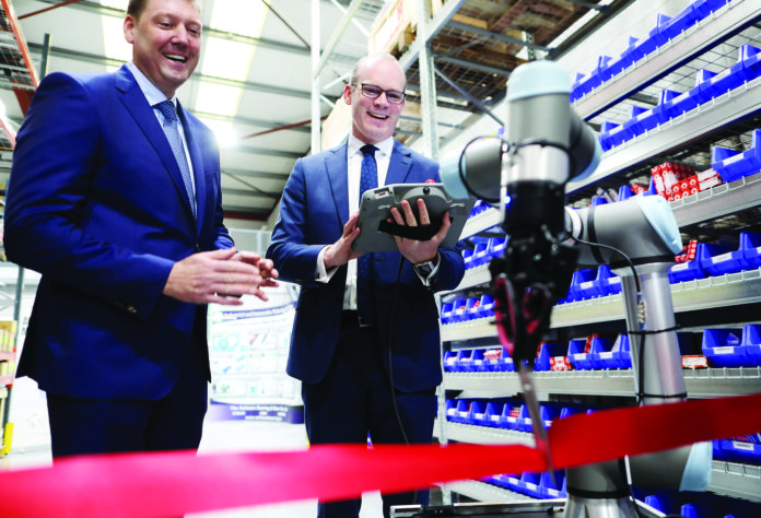 11/01/19. NO FEE. NO REPRO FEE. JULIEN BEHAL PHOTOGRAPHY. Picture shows l-r, Peter Creighton, Managing Director of Reliance and Tánaiste Simon Coveney. Tánaiste Simon Coveney experienced some of the smartest robots in the world making pizzas and performing to music today in Limerick, Friday, January 11th 2019. Fine Gael’s Deputy Leader, officially launched Universal Robot’s partnership with Reliance, a fourth-generation family business that has been providing technical solutions to Irish businesses since 1925. Reliance relocated to its newest state of the art facility last November and have coincided its new contract with Universal Robots to officially open the Limerick hub. JULIEN BEHAL PHOTOGRAPHY. NO FEE. Limerick Post News Business