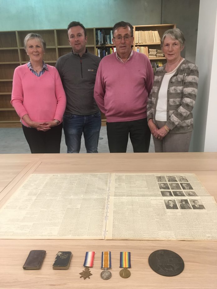 At UL’s Special Collections and Archives in the Glucksman Library are: (L-R) Kay Blake (Thomas Noonan’s niece), Michael Noonan (Noonan’s grandnephew), Michael Noonan Snr (Noonan’s nephew) and Breda Lyne (Noonan’s niece), with 1915 edition of The Sydney Morning Herald newspaper, as well as Thomas Noonan’s WWI service medals, diaries and the ‘Widow’s Penny’