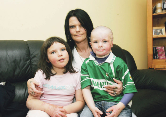 Sheila Murray with Millie, then aged seven and five-year-old Gavin a year after they sustained their horrific injuries. Photo: Brian Arthur/ Press 22.