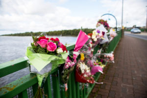 Floral tributes on the Shannon Bridge in Limerick. Photo: Cian Reinhardt