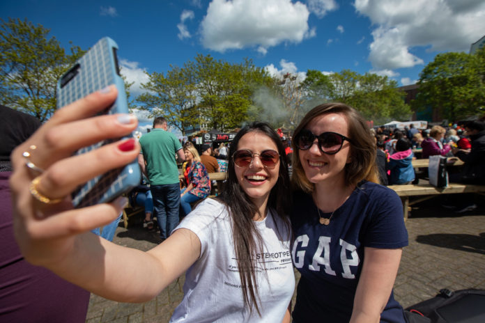 Limerick Student City 01 2019 Kaoany and Karin from Brazil soaking up the sunshine at the Riverfest village. Pic Sean Curtin True Media.