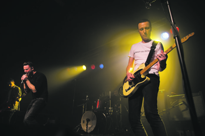 Tony Monahan playing guitar with Protobaby. Photo: Cian Reinhardt