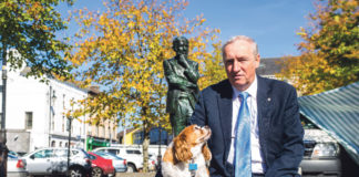 Pat O'Donovan pictured with Breezy in front of the Michael Hertnett Statue in Newcastle West Town Square. Photo: Cian Reinhardt