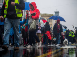 Protestors braving the downpour on the day. Photo: Cian Reinhardt