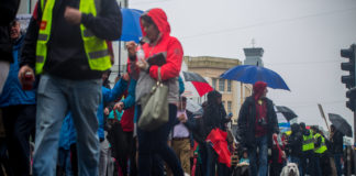 Protestors braving the downpour on the day. Photo: Cian Reinhardt