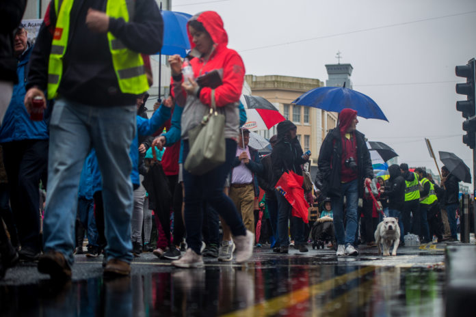 Protestors braving the downpour on the day. Photo: Cian Reinhardt Protestors braving the downpour on the day. Photo: Cian Reinhardt