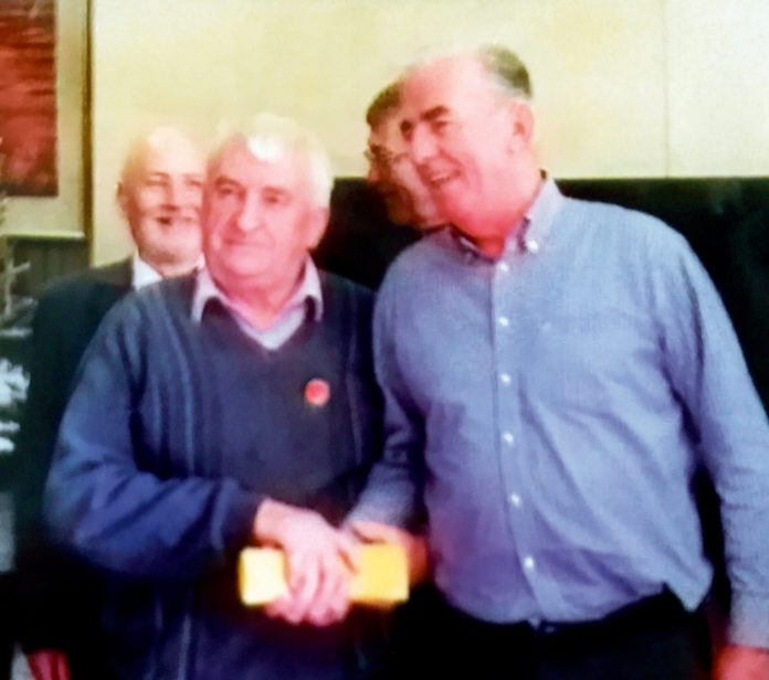 John Higgins (left) presenting the glasses to Morgan Darcy