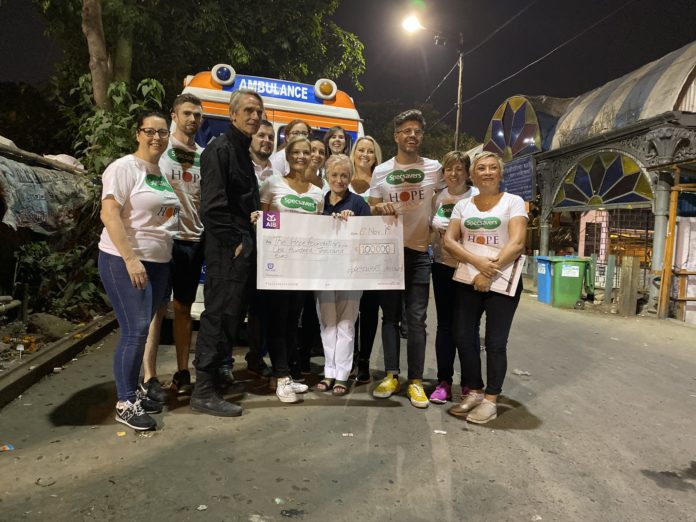 Specsavers present Maureen Forrest of The Hope Foundation with €100,000 cheque