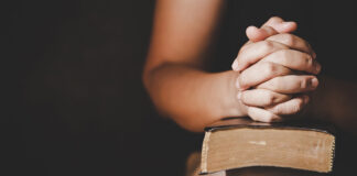 Christian life crisis prayer to god. Woman Pray for god blessing to wishing have a better life. woman hands praying to god with the bible. begging for forgiveness and believe in goodness.