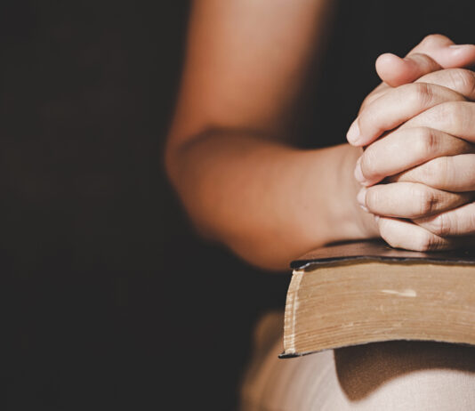 Christian life crisis prayer to god. Woman Pray for god blessing to wishing have a better life. woman hands praying to god with the bible. begging for forgiveness and believe in goodness.