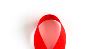 Aids Awareness Red heart Ribbon isolated on white background