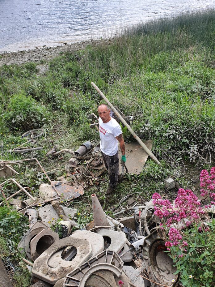 Billy Grieves at work on the riverbank before he was told to stop by Limerick City and County Council officials