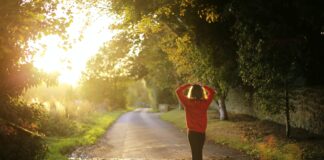 woman walking on pathway during daytime