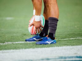 man holding rugby ball