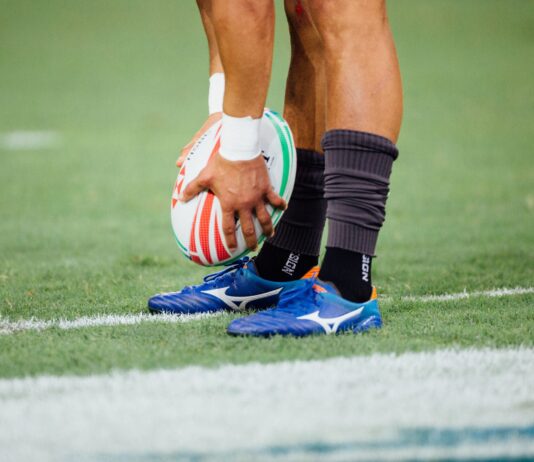 man holding rugby ball