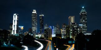 time lapse photo of passing cars during night time