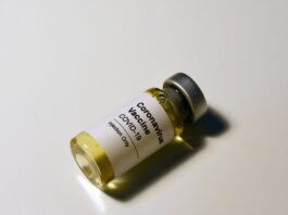 white and gold plastic bottle