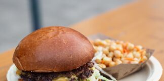 burger with lettuce and fries on white ceramic plate