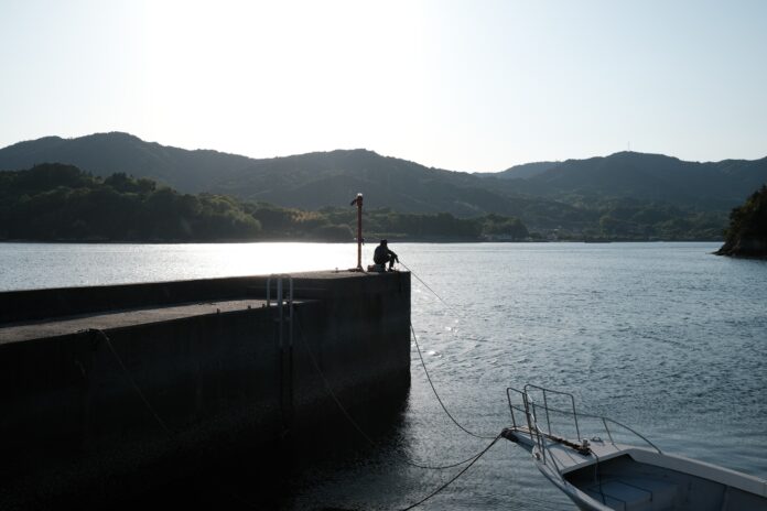 person in boat on sea during daytime