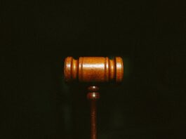 brown wooden stand with black background