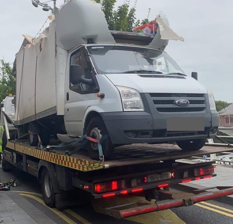 Delivery driver has lucky escape but cab is destroyed in collision with bridge