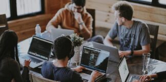 group of people using laptop computer