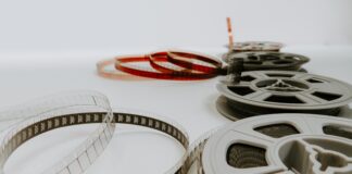 four reel films lying on white table