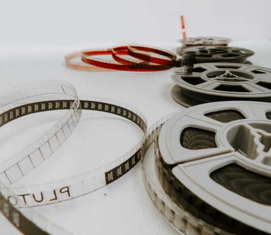 four reel films lying on white table