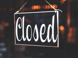 bokeh photography of closed signage