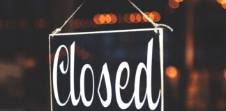 bokeh photography of closed signage