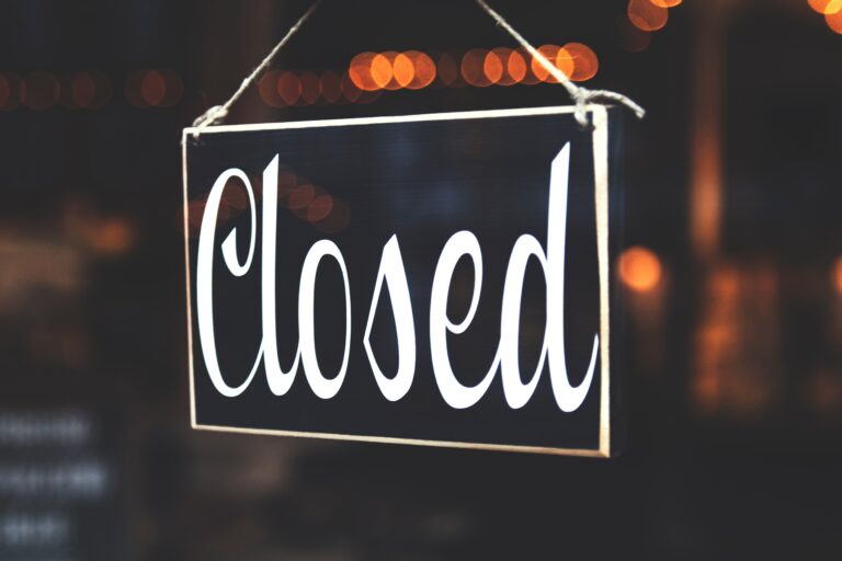 bokeh photography of closed signage