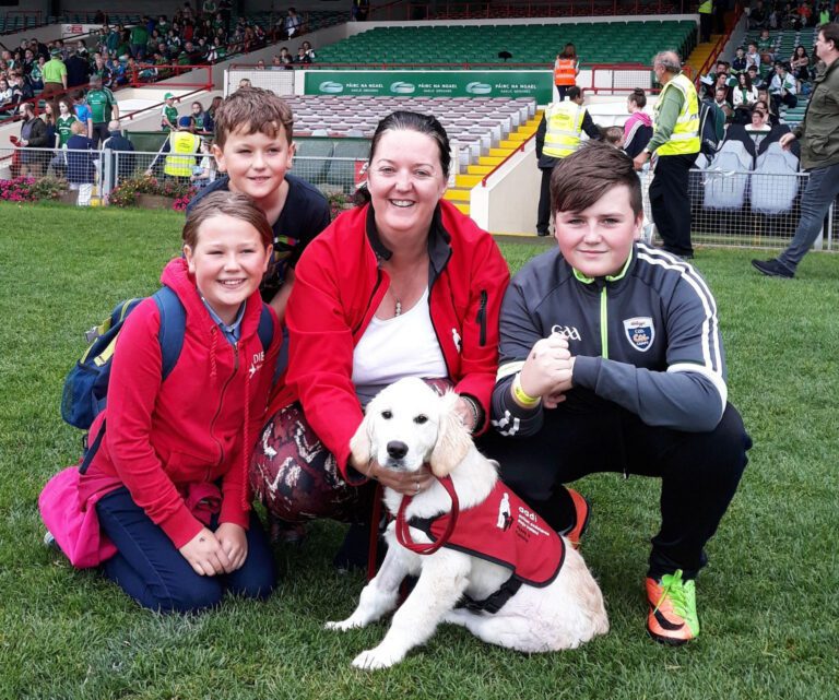 Michelle shares the joy of fostering autism assistance puppies