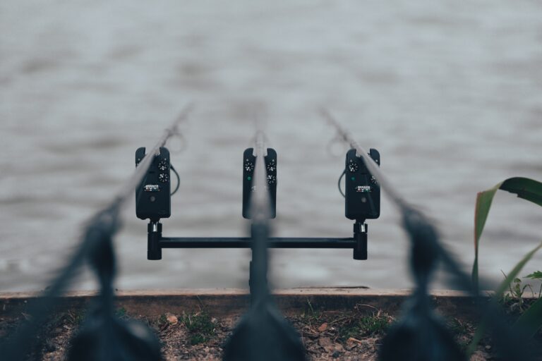 black metal padlock on black metal fence