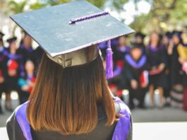 woman wearing academic cap and dress selective focus photography