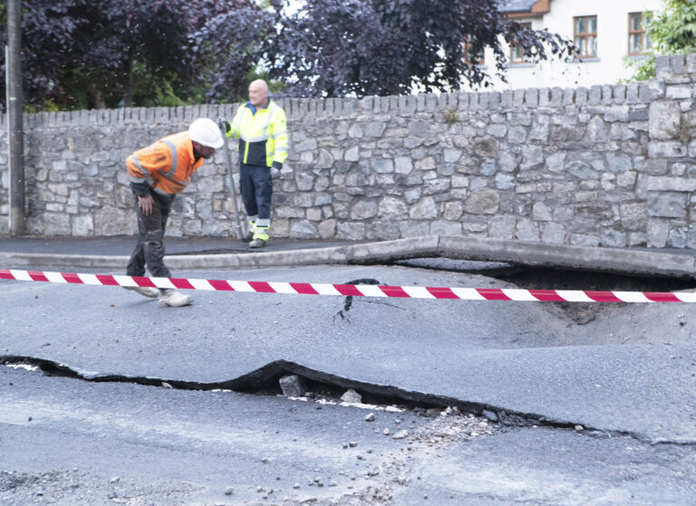 Water mains burst left Limerick/Clare border road like earthquake scene