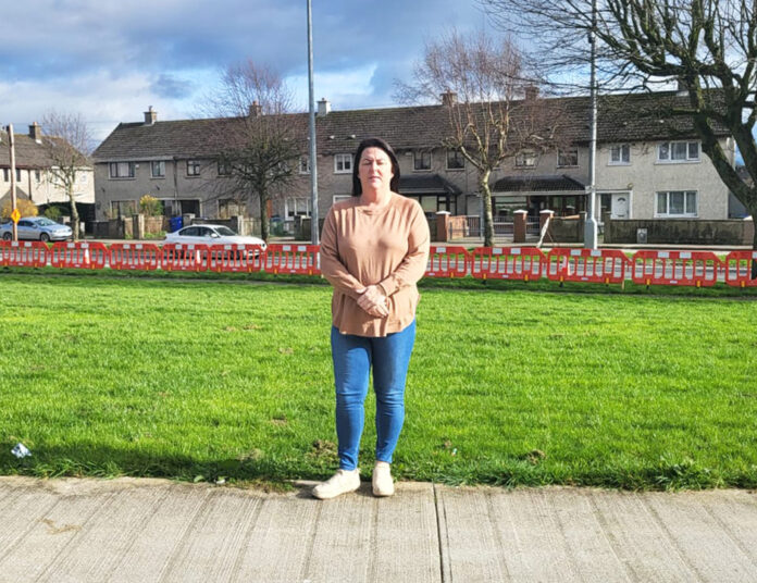 Catherine Slattery with the Hyde Road road works in the background.