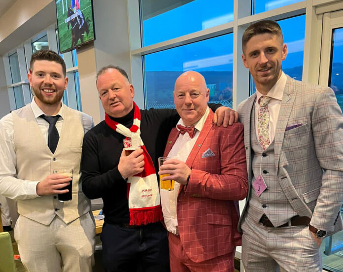 Trainer Paddy Neville, his nephew Brian, lead owner Davy Mann and Danny Neville, former Limerick footballer, toast Cheltenham success.