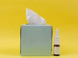 white and brown bottle beside white tissue box