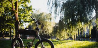 black and gray motorcycle on green grass field during daytime