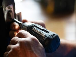 selective focus photography blue and black Makita power drill