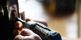 selective focus photography blue and black Makita power drill