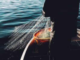 man holding a fishnet